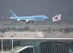 South Korean workers who were released after days of detention in Georgia return home